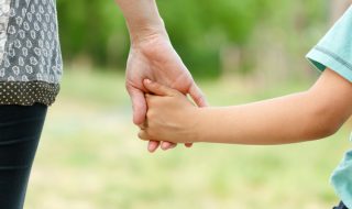 parent and child holding hands