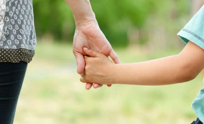 parent and child holding hands