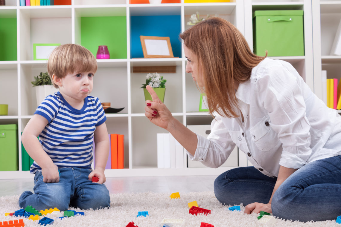 a mum disciplining her son