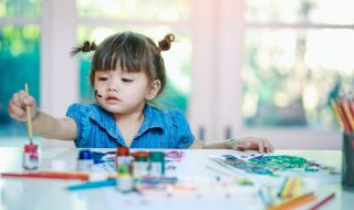 a toddler painting