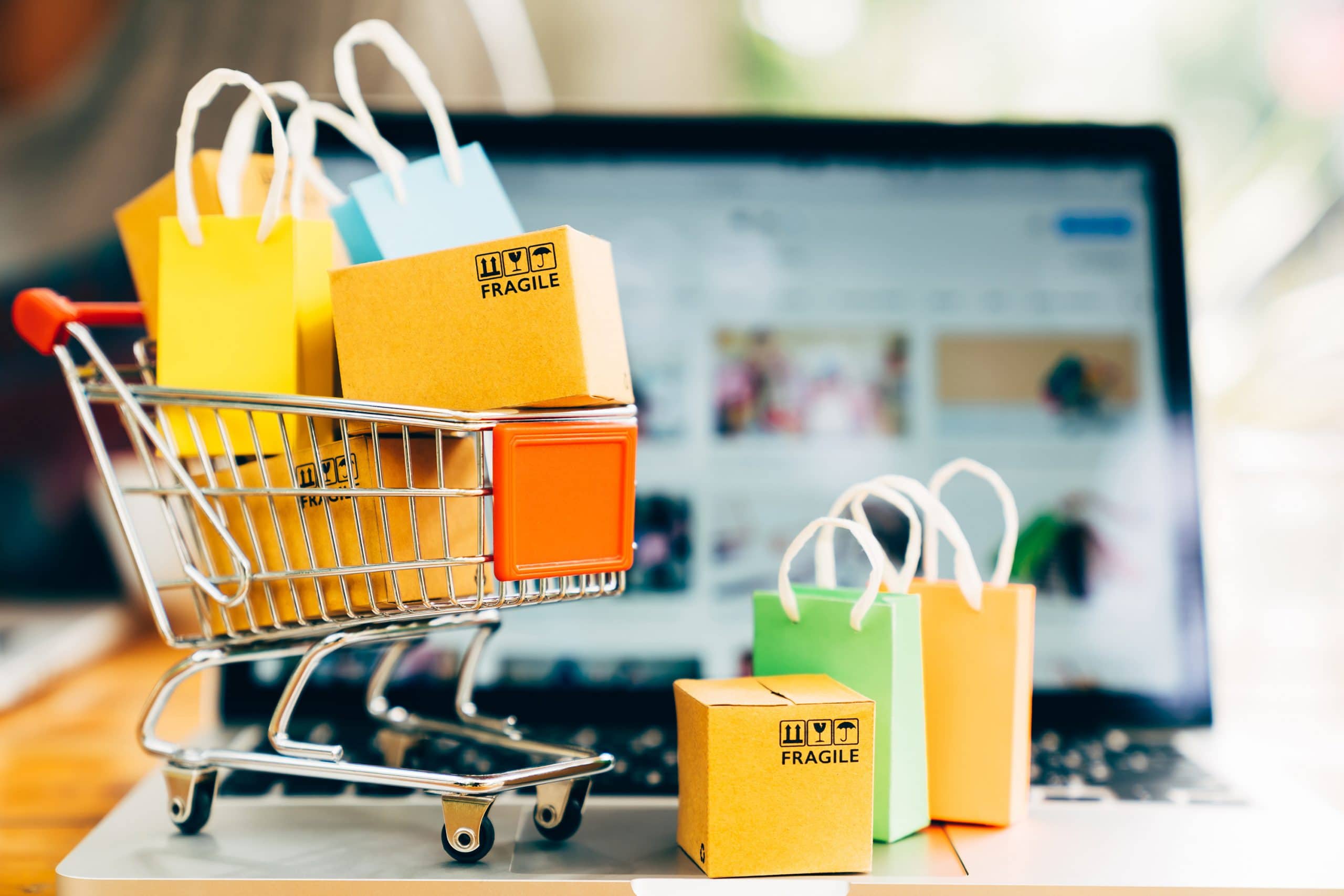 a toy cart with miniature shopping bags and boxes