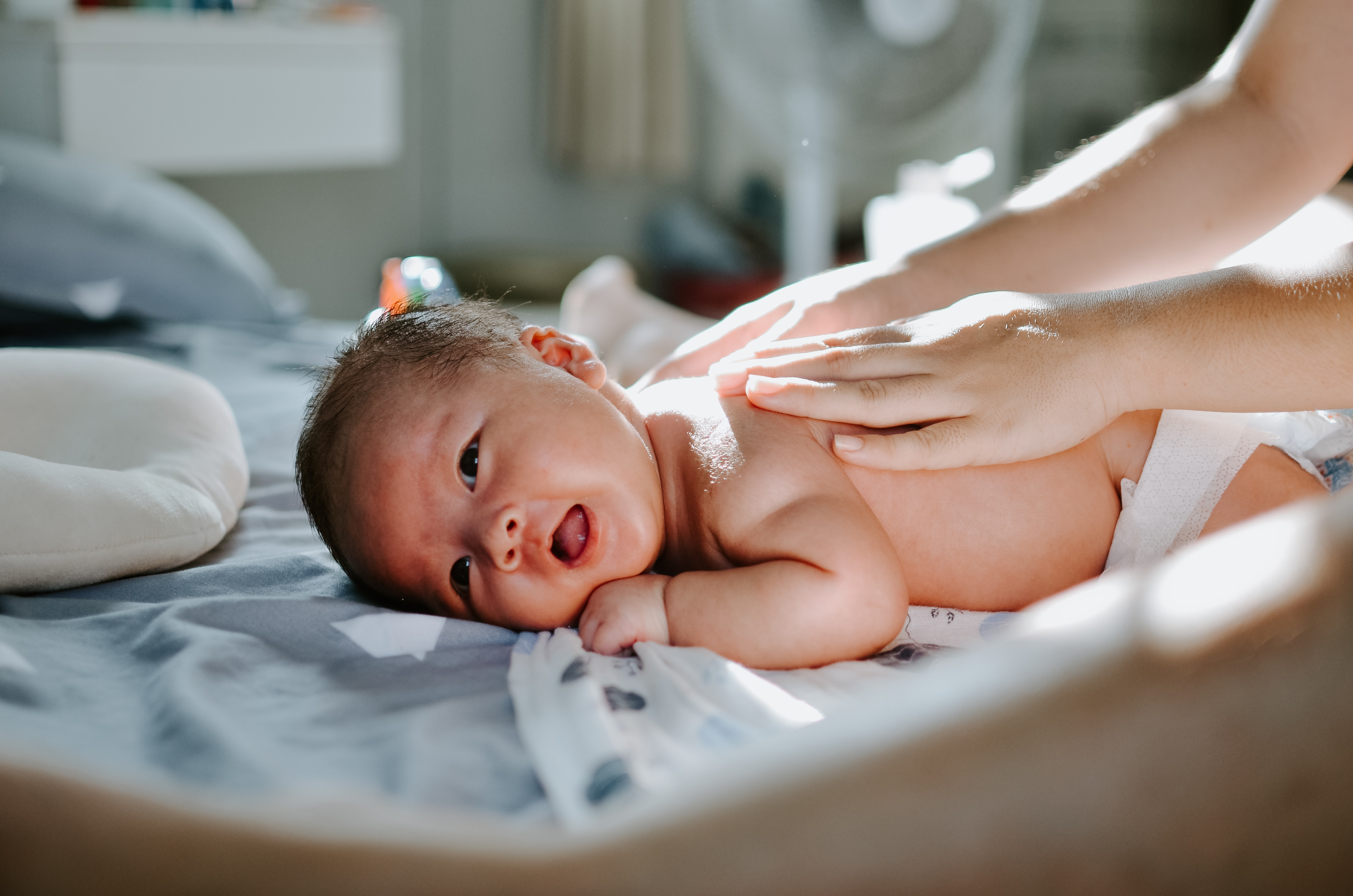 a newborn on the bed