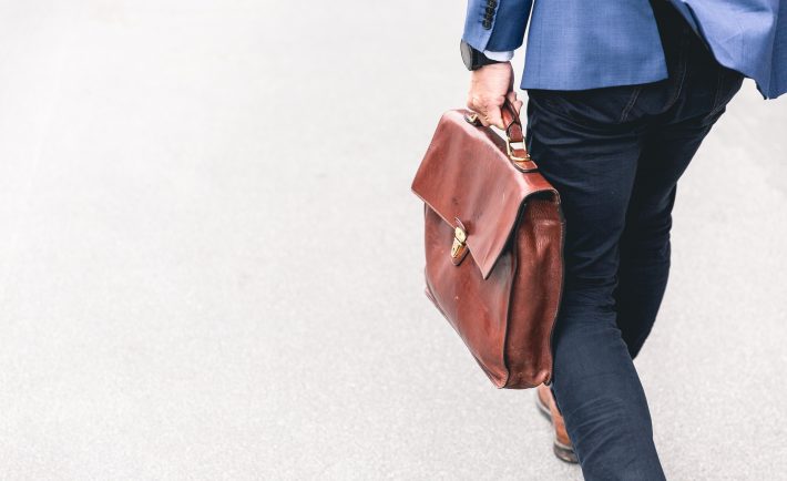 a man holding a briefcase