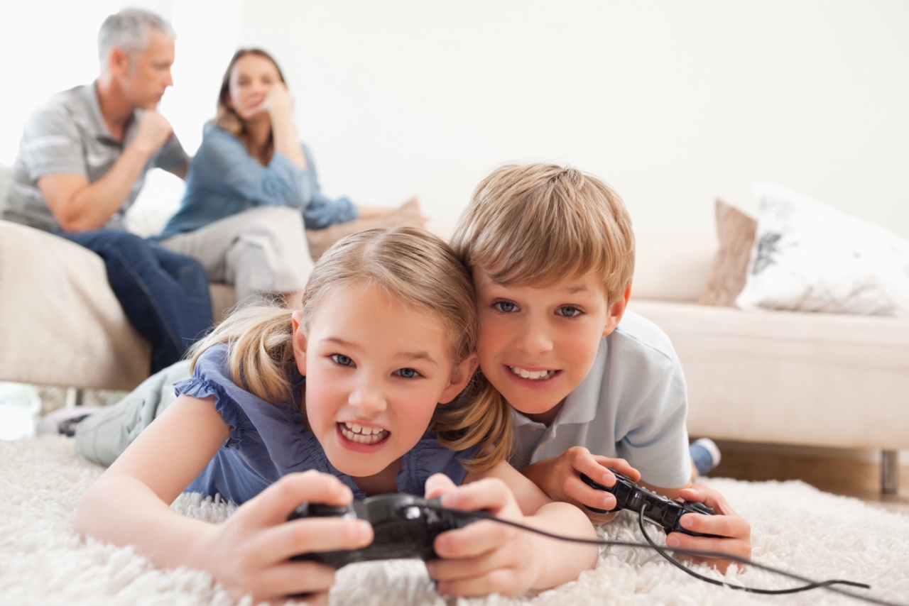 parents looking from behind as their kids play video games