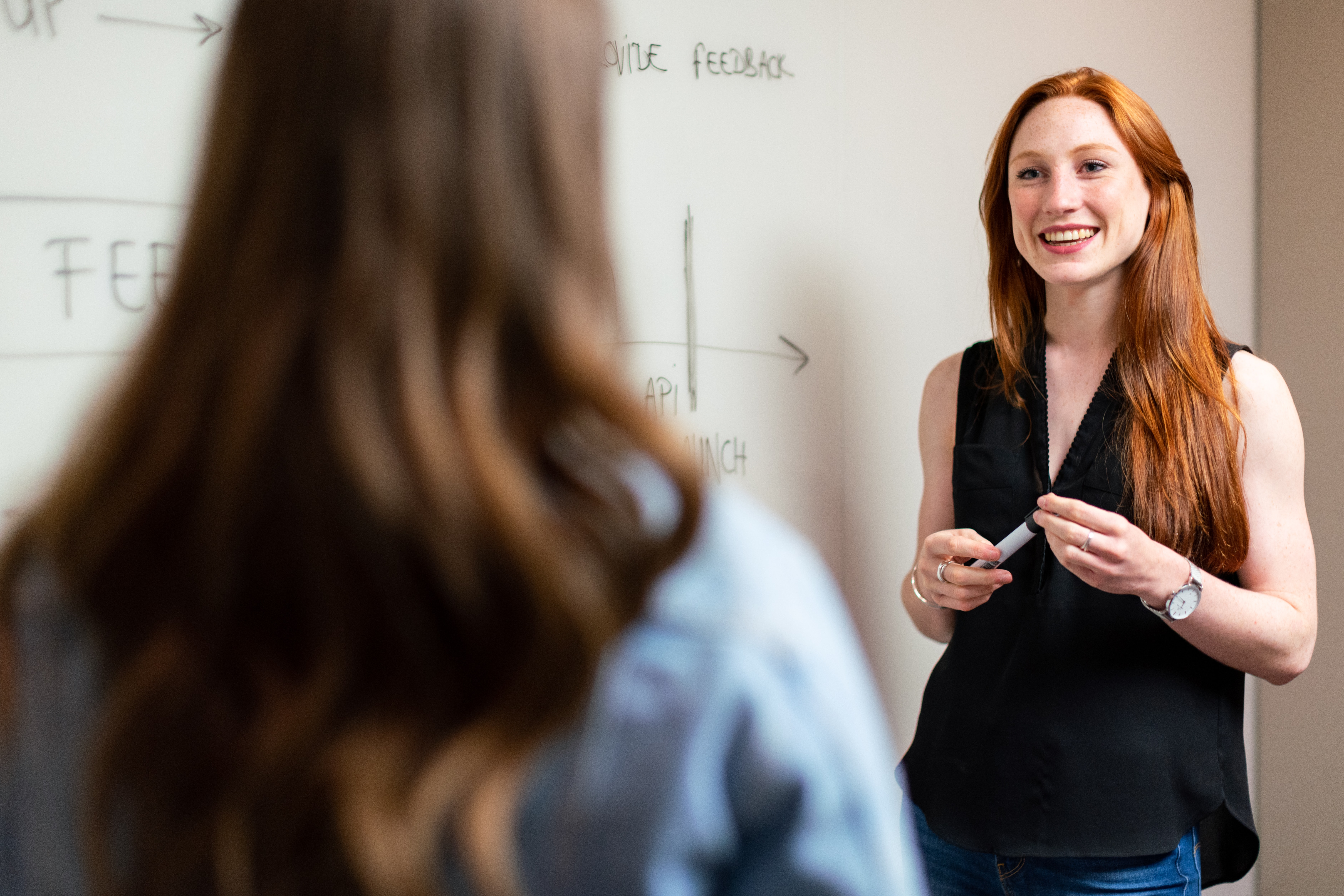 a woman in a meeting with her colleague