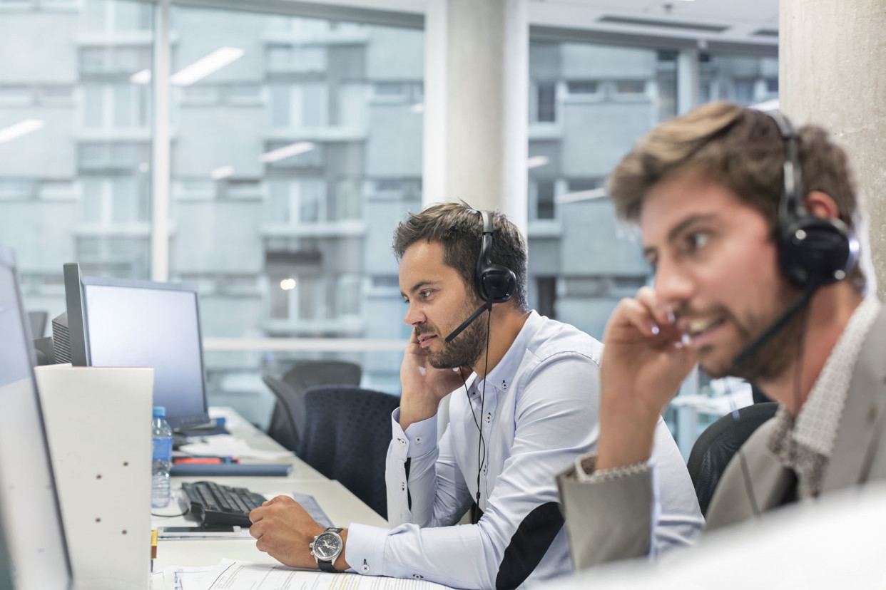 two guys in a call center setting