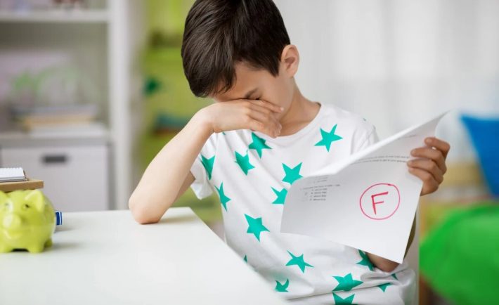 a boy upset with his test results