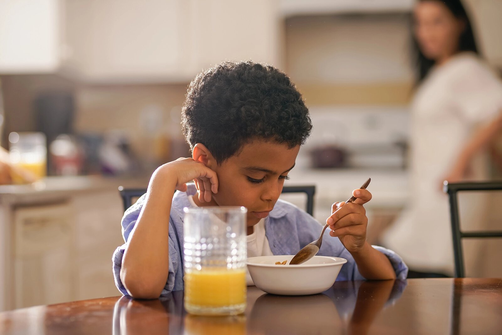 a child eating breakfast