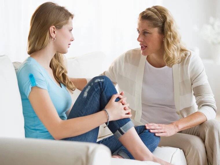 a mum having a talk with her teen daughter