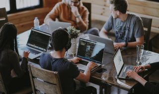 group of people using laptops