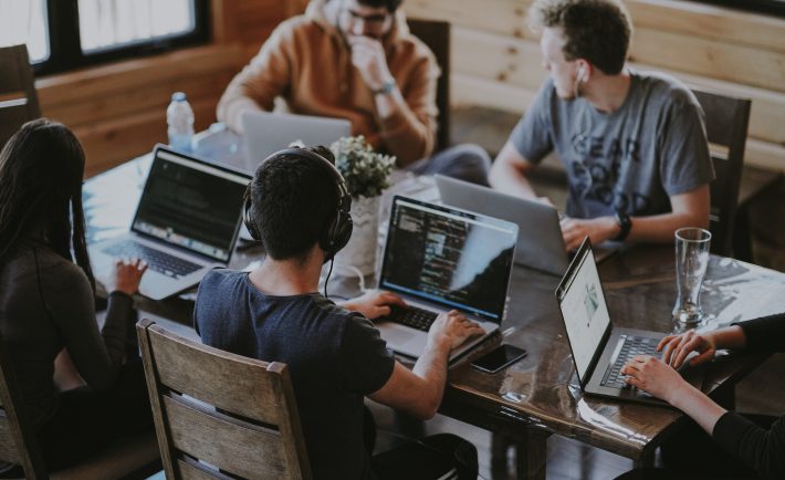 group of people using laptops