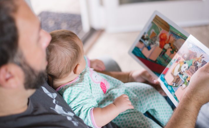 reading a book to a toddler