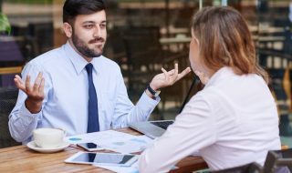 two colleagues in an unhappy discussion