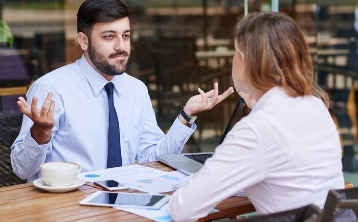 two colleagues in an unhappy discussion