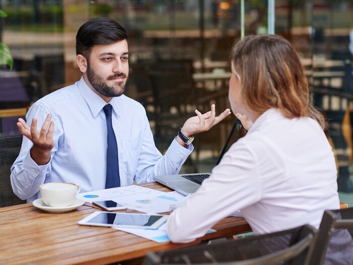 two colleagues in an unhappy discussion