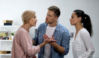 a young man settling conflict between mother and wife