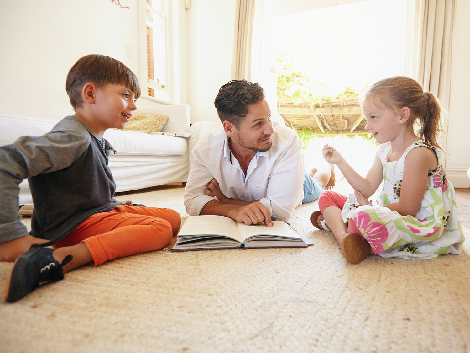 dad in a conversation with two kids