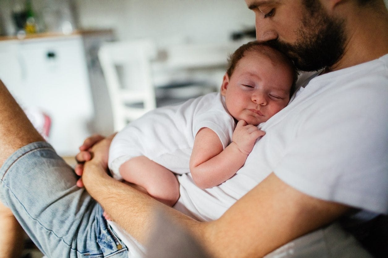 dad with newborn