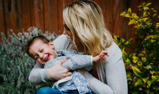 mother and son giggling