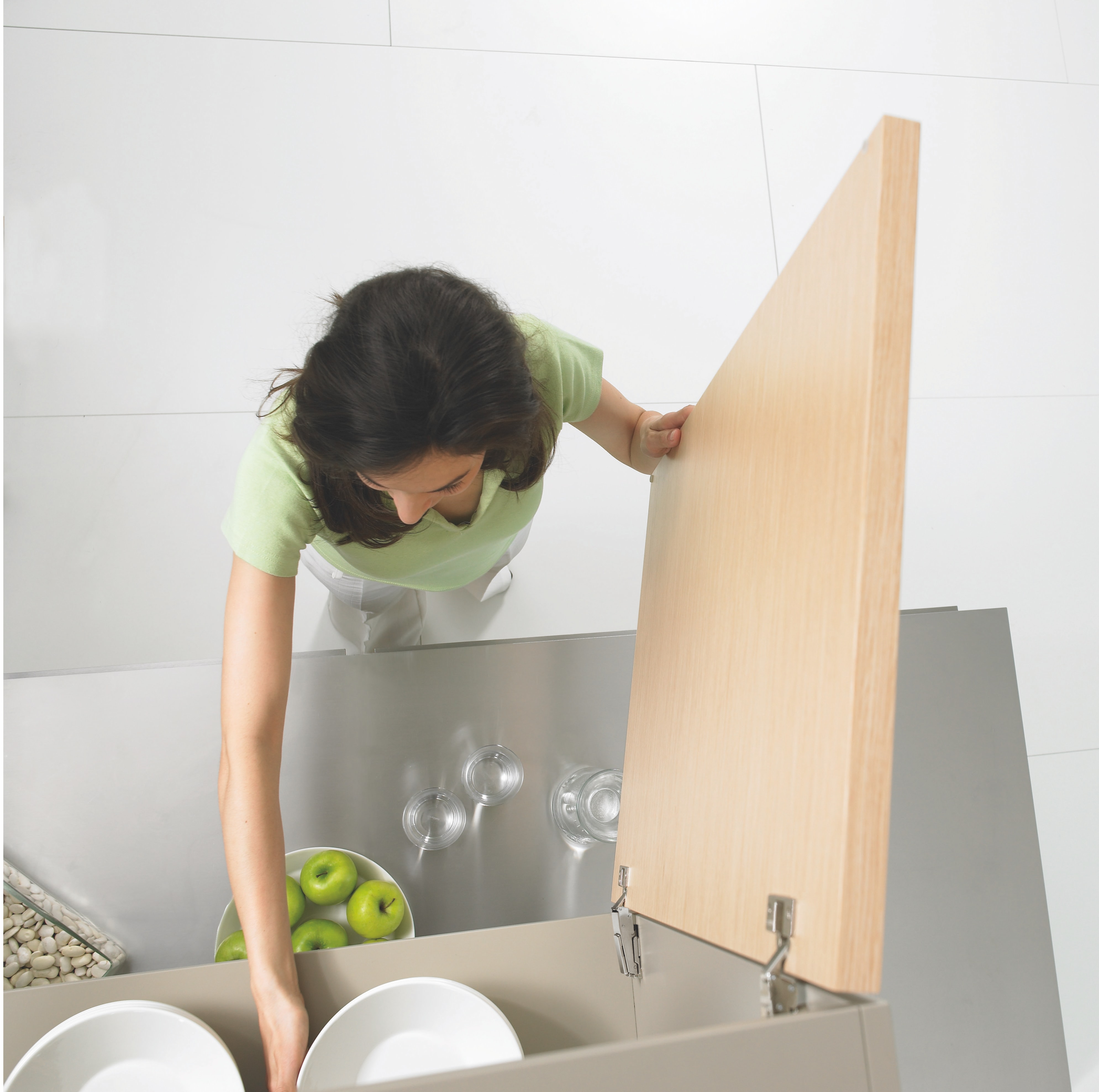 woman tidying her kitchen