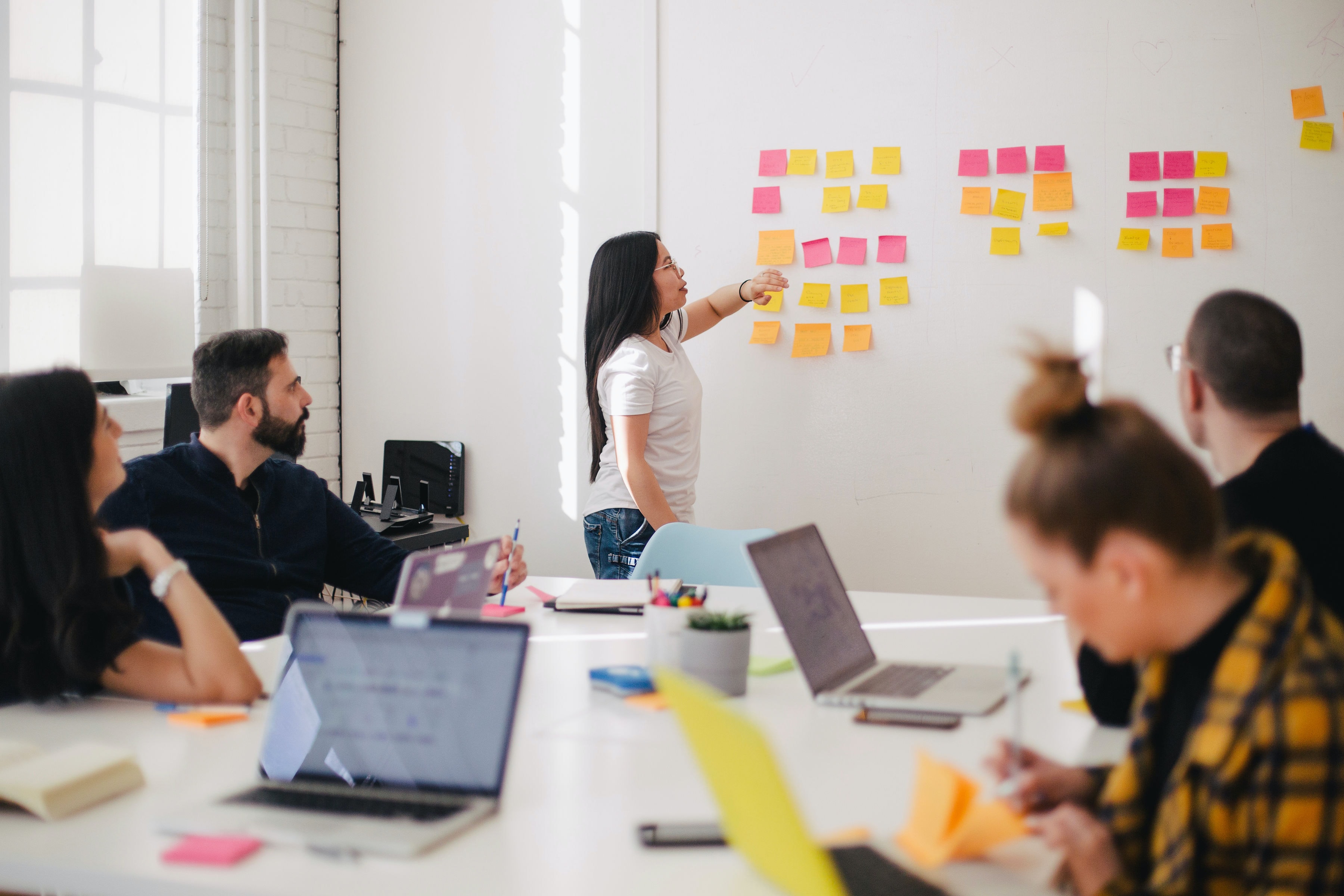 woman presenting using sticky notes