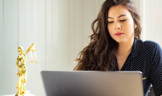 woman focusing on the task on her laptop