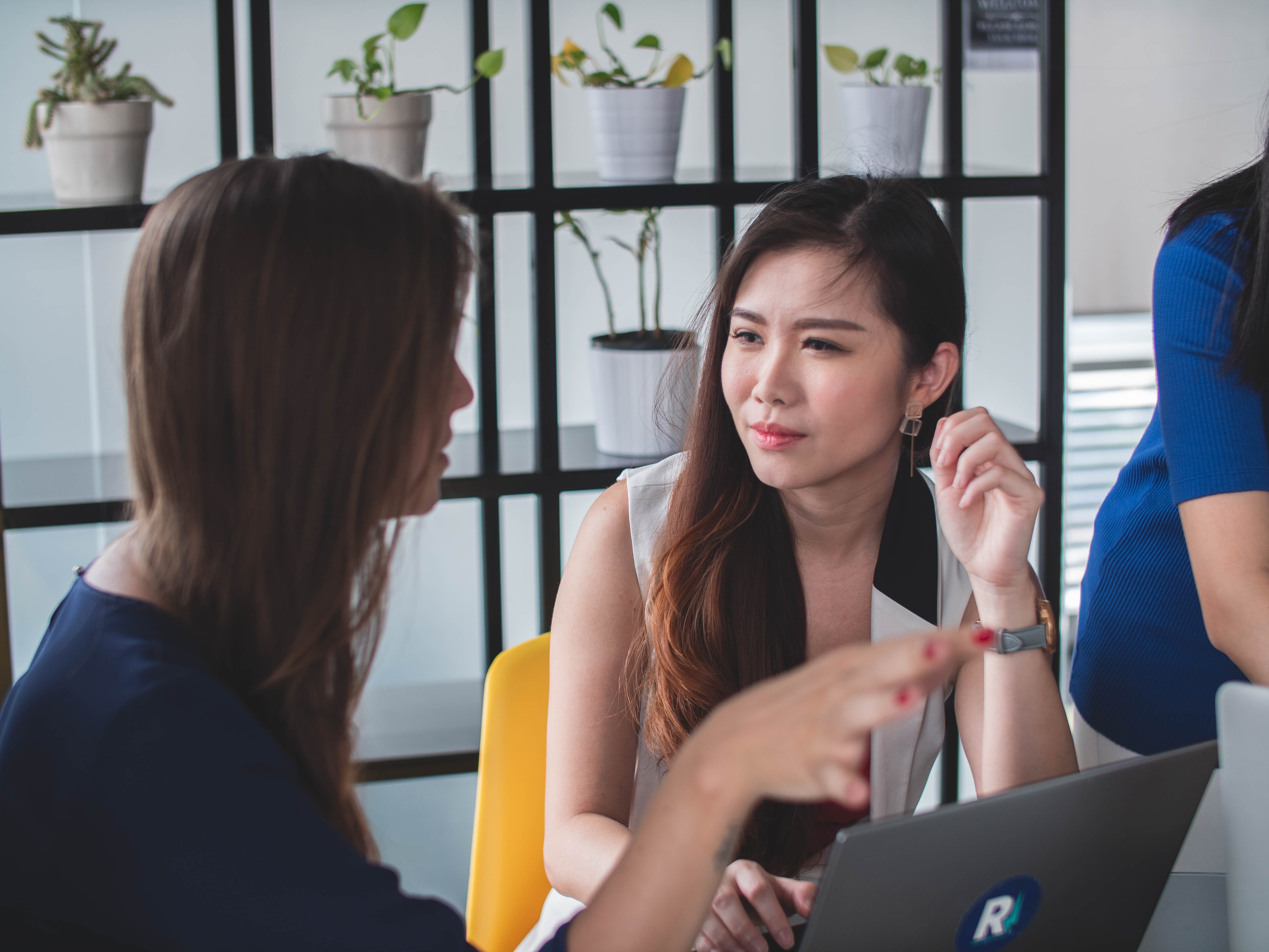 woman paying attention to her colleague speaking