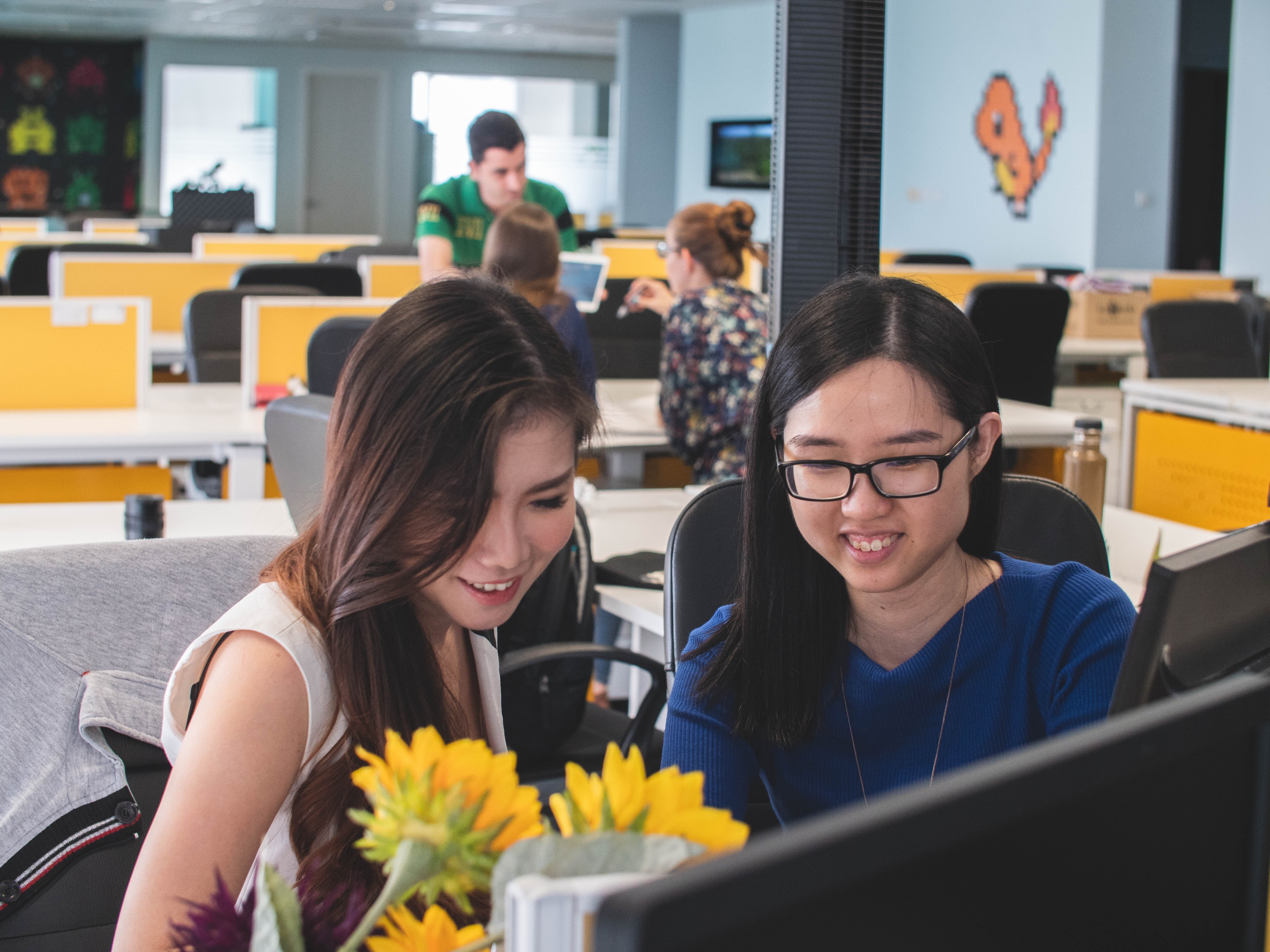 female coworkers discussing about work