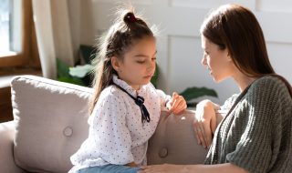 mother talking to her daughter