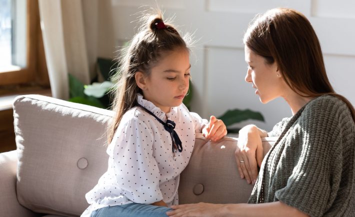 mother talking to her daughter