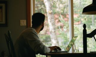 man looking out of the window