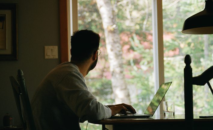 man looking out of the window