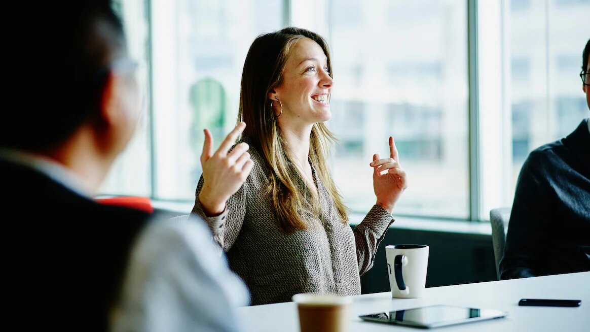 a woman with animated actions in a meeting