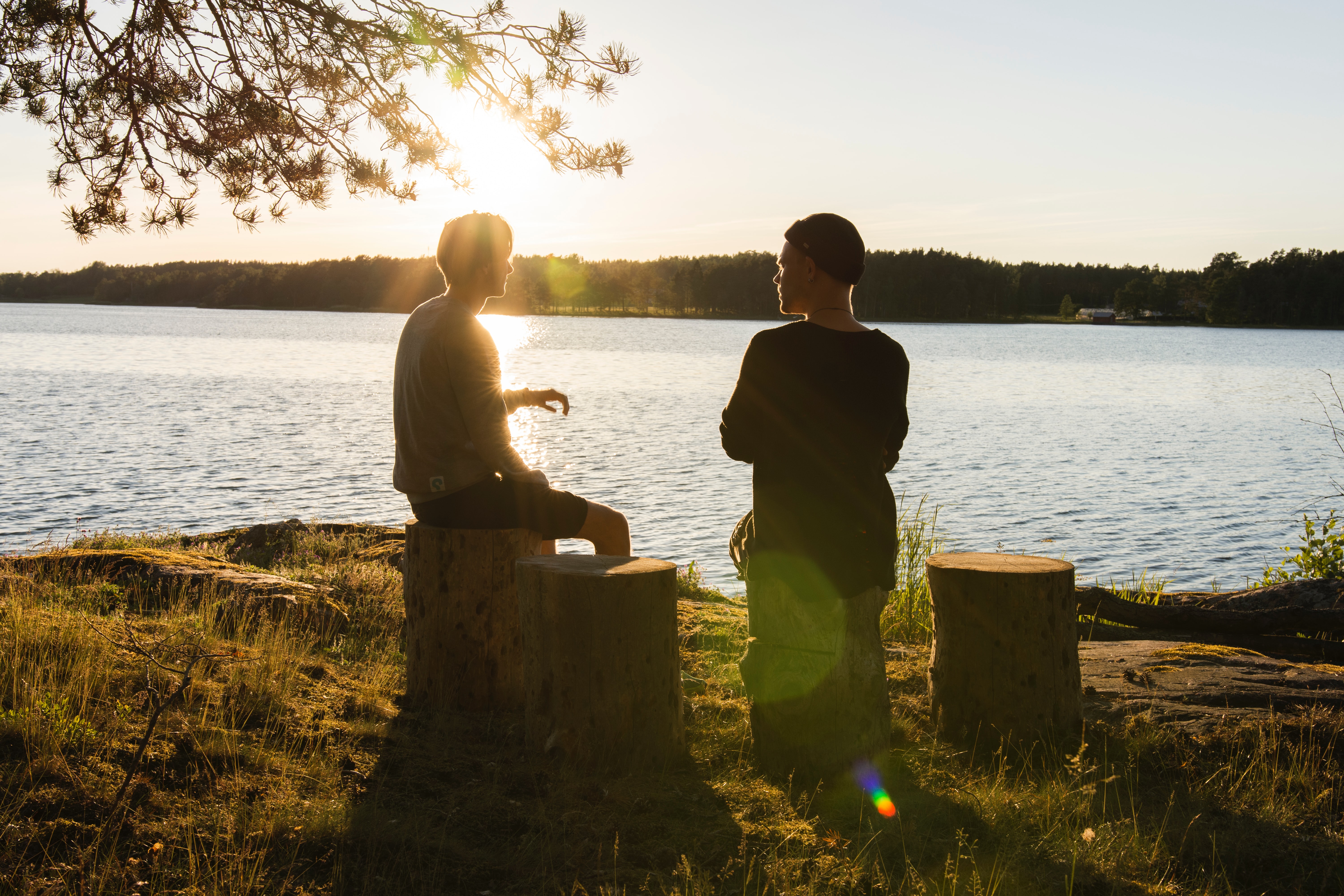 friends talking near the ocean