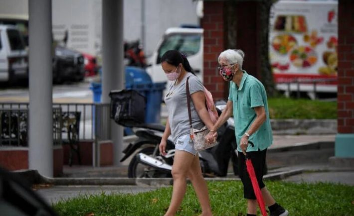 an elderly with a family member