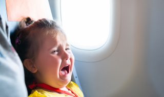 child crying in a plane