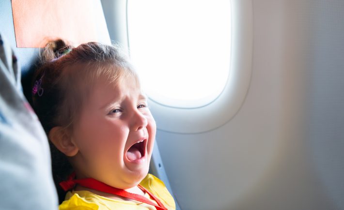 child crying in a plane