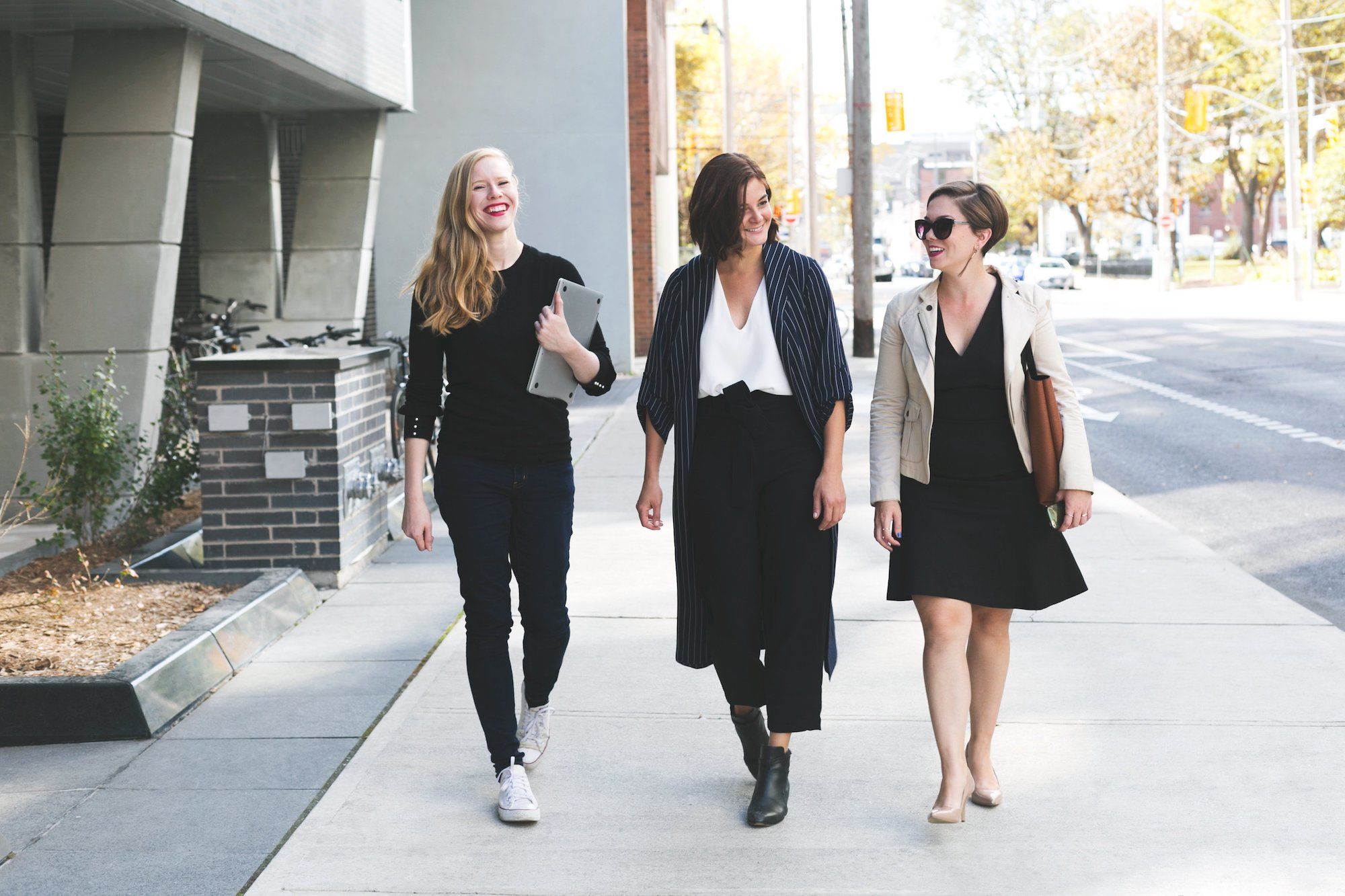 female coworkers walking and talking