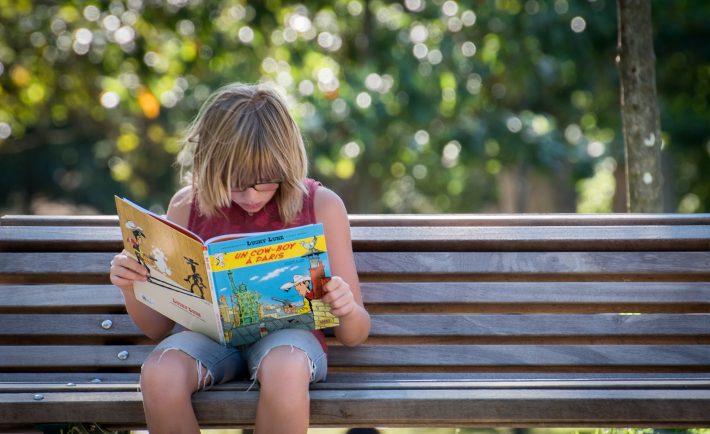 kid reading a book