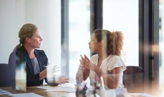 a female boss talking to her employee