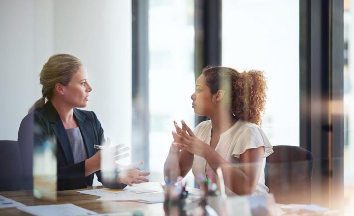 a female boss talking to her employee