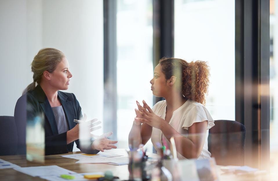 a female boss talking to her employee