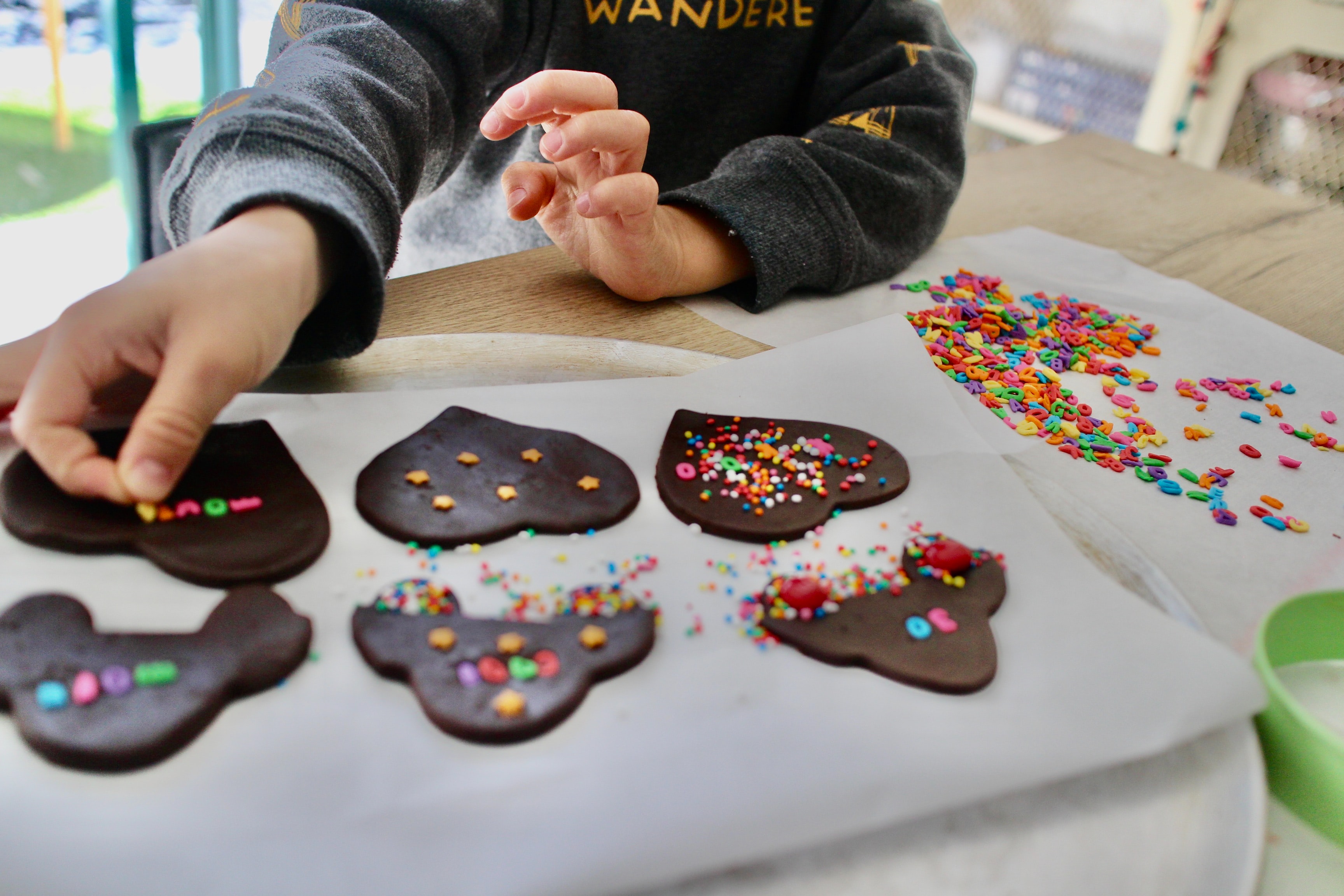 child decorating cookies