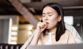 asian woman coughing