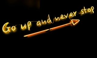 go up and never stop neon sign