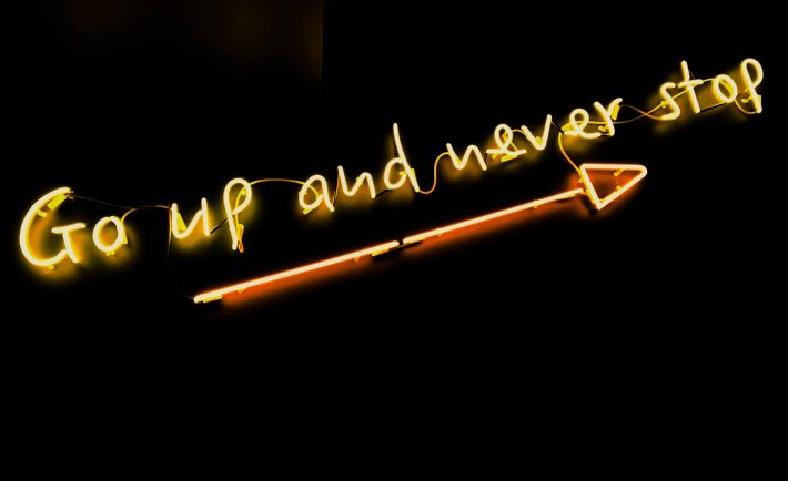 go up and never stop neon sign