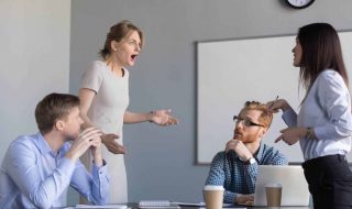 female colleagues disagreeing in a meeting