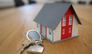 a miniature house with a key