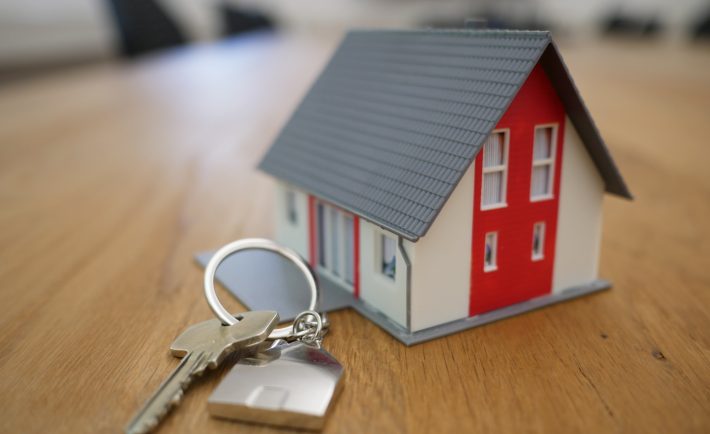 a miniature house with a key