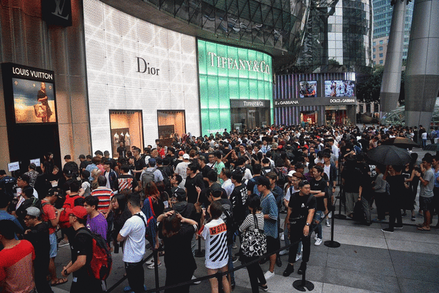 Singaporeans queuing outdoors